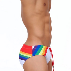 a sexy man in Men’s Pride Passion Swim Brief with Pad - pridevoyageshop.com - gay men’s sexy swim briefs, trunks, board shorts, and bikinis