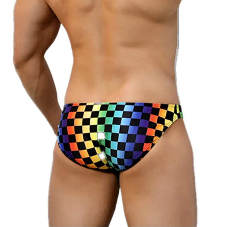 a sexy man in Men’s Pride Pit Stop Rainbow Swim Briefs - pridevoyageshop.com - gay men’s sexy swim briefs, trunks, board shorts, and bikinis