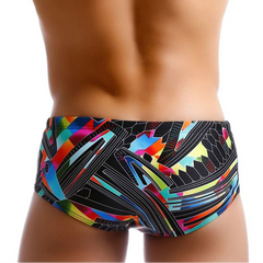a sexy man in Men’s Pride Voltage Low Rise Swim Trunks with pad – pridevoyageshop.com – gay men’s sexy swim briefs, trunks, board shorts, and bikinis