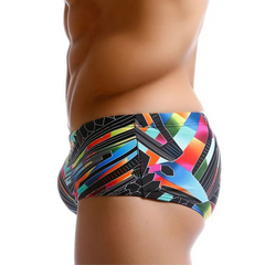 a sexy man in Men’s Pride Voltage Low Rise Swim Trunks with pad – pridevoyageshop.com – gay men’s sexy swim briefs, trunks, board shorts, and bikinis