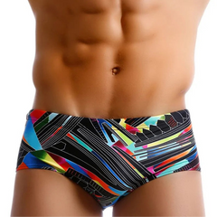 a sexy man in Men’s Pride Voltage Low Rise Swim Trunks with pad – pridevoyageshop.com – gay men’s sexy swim briefs, trunks, board shorts, and bikinis