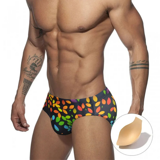 a sexy man in Men’s Rainbow Leafs Swim Briefs with pad - pridevoyageshop.com - gay men’s sexy swim briefs, trunks, board shorts, and bikinis