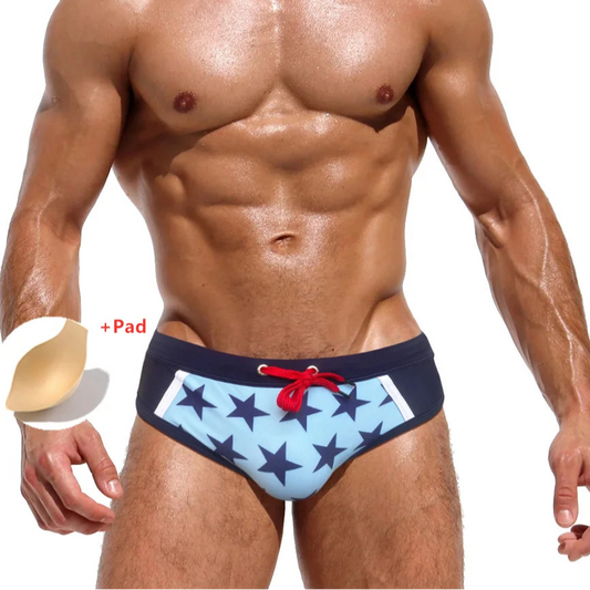 a sexy man in Men’s Star-Spangled Swim Briefs with pad - pridevoyageshop.com - gay men’s sexy swim briefs, trunks, board shorts, and bikinis