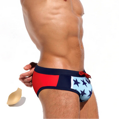 a sexy man in Men’s Star-Spangled Swim Briefs with pad - pridevoyageshop.com - gay men’s sexy swim briefs, trunks, board shorts, and bikinis