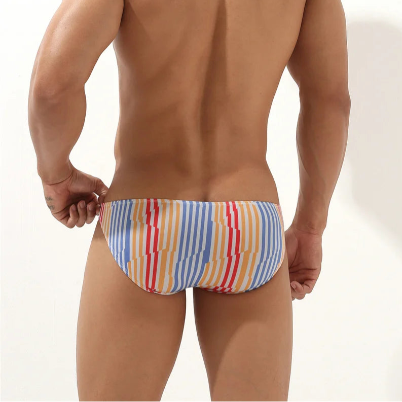 a sexy man in Men’s Verti-Call Me Swim Briefs - pridevoyageshop.com - gay men’s sexy swim briefs, trunks, board shorts, and bikinis