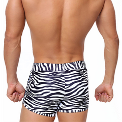 a sexy man in Men’s Werk the Wild Ibiza Stripe Swim Trunks no pad – pridevoyageshop.com – gay men’s sexy swim briefs, trunks, board shorts, and bikinis