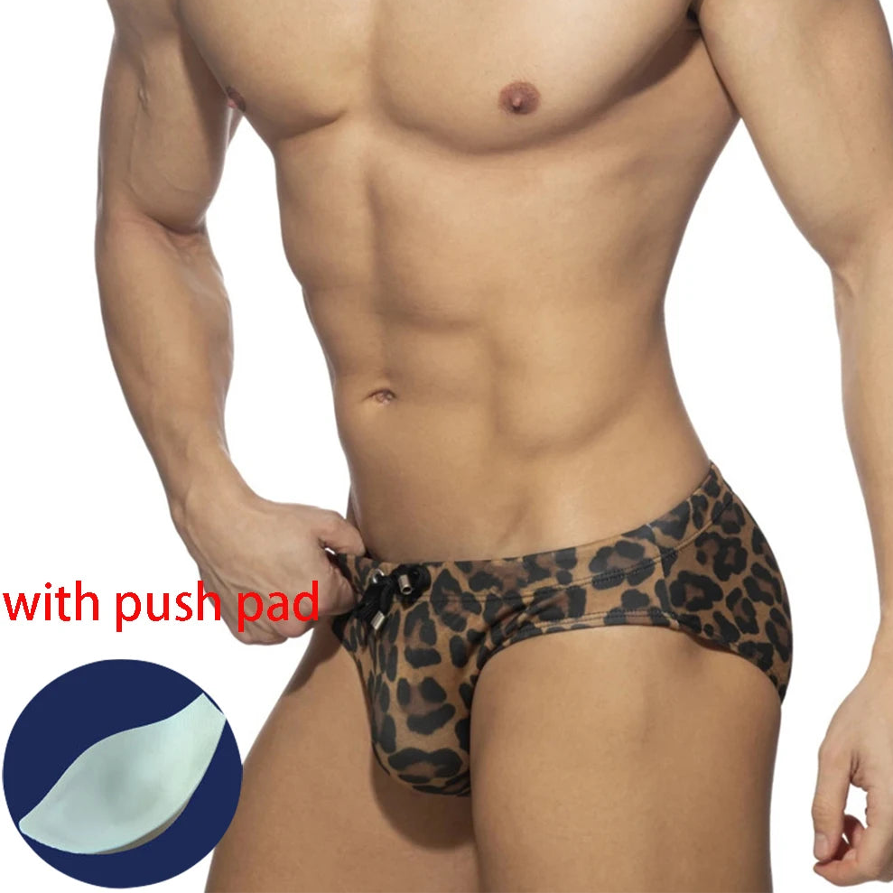 a sexy man in Men's Wildcat Leopard Bikini Swim Briefs with pad - pridevoyageshop.com - gay men’s sexy swim briefs, trunks, board shorts, and bikinis