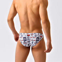 a sexy man in Nautical Play Men’s Red Light Marina Mesh Bikini Swim Briefs - pridevoyageshop.com - gay men’s sexy swim briefs, trunks, board shorts, and bikinis