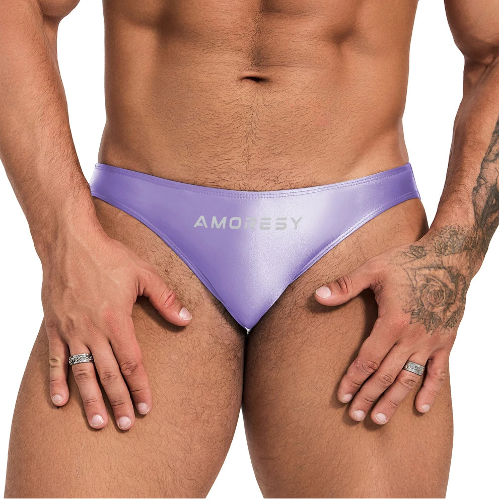 a sexy man in Pastel Lilac Men’s Shiny Lube Job Mini Swim Briefs - pridevoyageshop.com - gay men’s sexy swim briefs, trunks, board shorts, and bikinis
