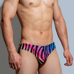 a sexy man in Rainbow Zebra Men’s Savage Safari Swim Briefs - pridevoyageshop.com - gay men’s sexy swim briefs, trunks, board shorts, and bikinis