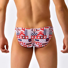 a sexy man in Signal Flags Men’s Red Light Marina Mesh Bikini Swim Briefs - pridevoyageshop.com - gay men’s sexy swim briefs, trunks, board shorts, and bikinis