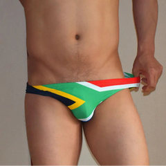 a sexy man in South Africa Flag flag Men’s World Tour Bikini Swim Briefs - pridevoyageshop.com - gay men’s sexy swim briefs, trunks, board shorts, and bikinis