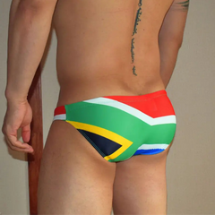 a sexy man in South Africa Flag flag Men’s World Tour Bikini Swim Briefs - pridevoyageshop.com - gay men’s sexy swim briefs, trunks, board shorts, and bikinis