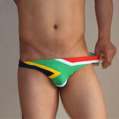 a sexy man in South Africa flag Men’s Flag Frenzy Swim Briefs - pridevoyageshop.com - gay men’s sexy swim briefs, trunks, board shorts, and bikinis