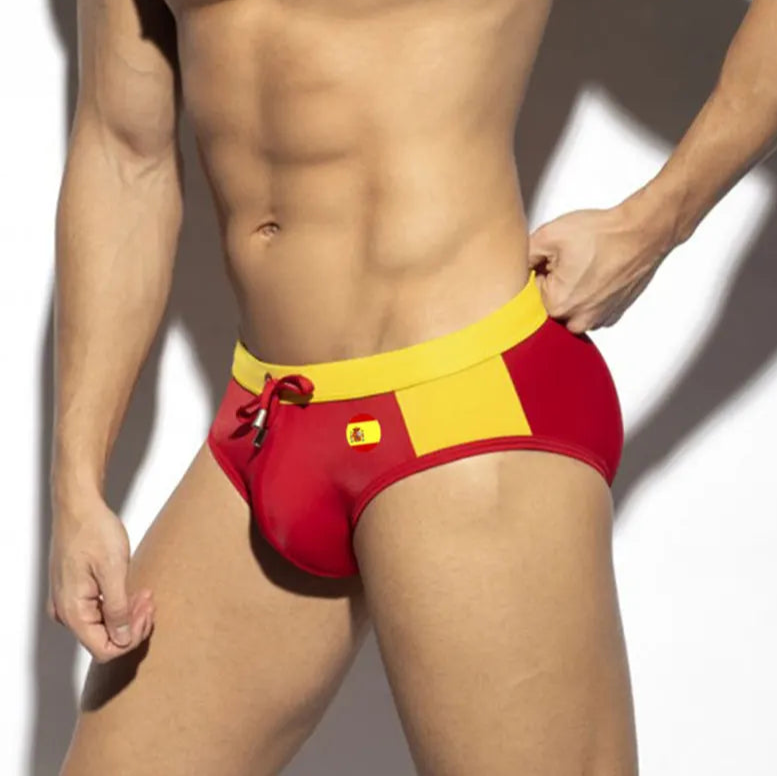 a sexy man in Spain flag Men’s World Play National Flags Swim Briefs - pridevoyageshop.com - gay men’s sexy swim briefs, trunks, board shorts, and bikinis