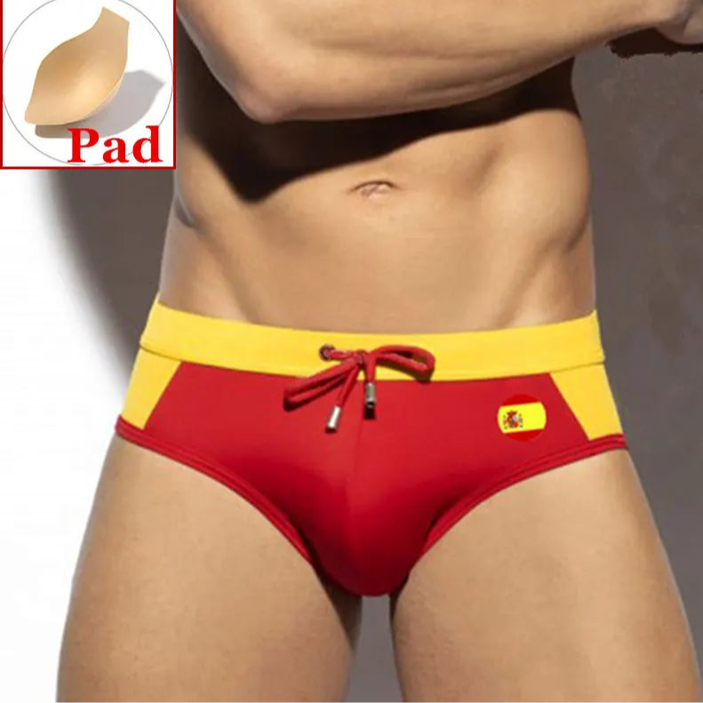 a sexy man in Spain flag Men’s World Play National Flags Swim Briefs with pad - pridevoyageshop.com - gay men’s sexy swim briefs, trunks, board shorts, and bikinis