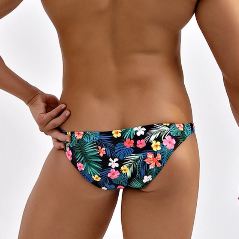 a sexy man in Tropical Floral Men’s Summer Bloom Swim Bikini Briefs - pridevoyageshop.com - gay men’s sexy swim briefs, trunks, board shorts, and bikinis