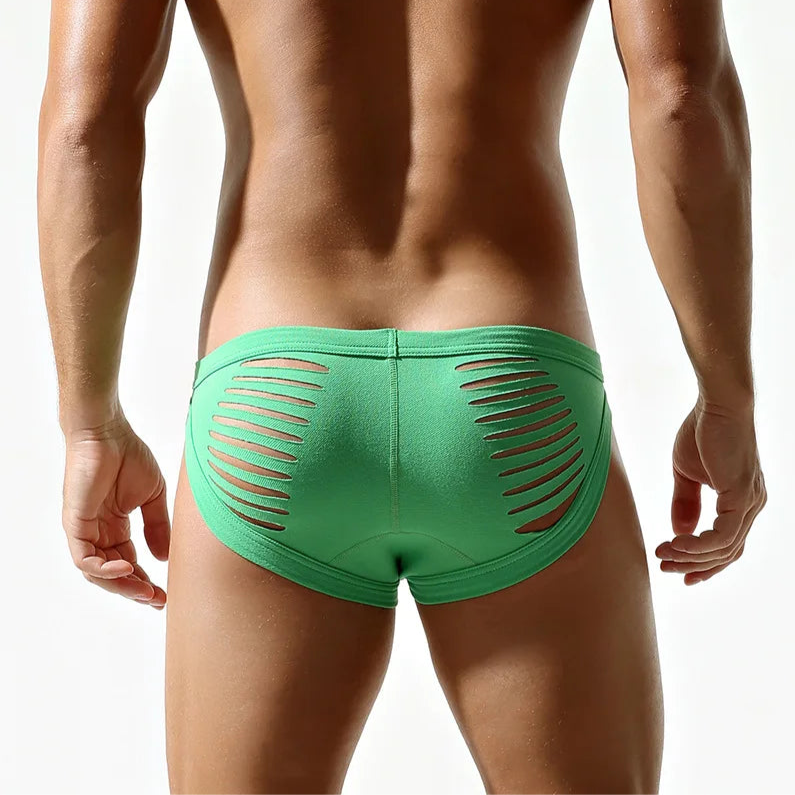 a sexy man in Turquoise DM Men’s “Rip Me” Slashed Booty Briefs - pridevoyageshop.com - gay men’s thongs, boxers, briefs and jockstraps