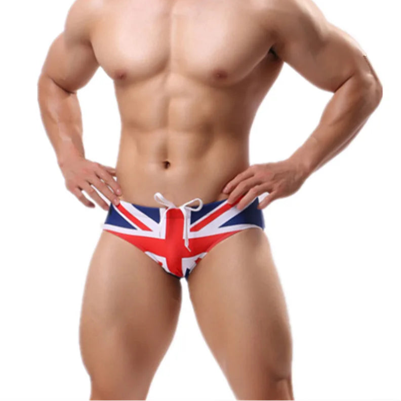 a sexy man in UK flag Men’s Flagged & Fitted Low Rise Swim Briefs - pridevoyageshop.com - gay men’s sexy swim briefs, trunks, board shorts, and bikinis