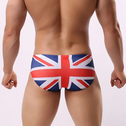 a sexy man in UK flag Men’s Flagged & Fitted Low Rise Swim Briefs - pridevoyageshop.com - gay men’s sexy swim briefs, trunks, board shorts, and bikinis
