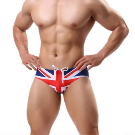 a sexy man in UK flag Men’s Flagged & Fitted Low Rise Swim Briefs - pridevoyageshop.com - gay men’s sexy swim briefs, trunks, board shorts, and bikinis