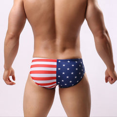 a sexy man in US flag Men’s Flagged & Fitted Low Rise Swim Briefs - pridevoyageshop.com - gay men’s sexy swim briefs, trunks, board shorts, and bikinis