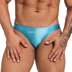 a sexy man in Waterspout Blue Men’s Shiny Lube Job Mini Swim Briefs - pridevoyageshop.com - gay men’s sexy swim briefs, trunks, board shorts, and bikinis