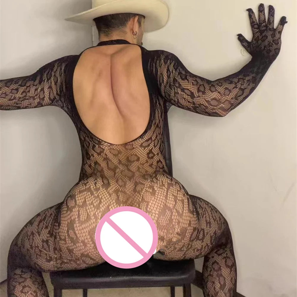 a sexy man in a black snakeskin-lace catsuit with sheer reptile-pattern mesh, body-hugging silhouette and teasing cutouts – pridevoyageshop.com – gay men’s harness, lingerie and fetish wear