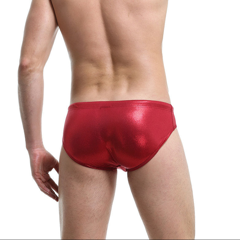 a sexy man in a sexy man in red Men’s Slay the Shine Shiny Swim Briefs - pridevoyageshop.com - gay men’s sexy swim briefs, trunks, board shorts, and bikinis