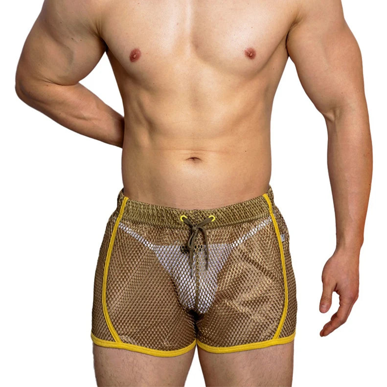 a sexy man in army green DM Men’s Trade Bait See-Thru Mesh Shorts – pridevoyageshop.com – gay men’s sexy swim briefs, trunks, board shorts, and bikinis
