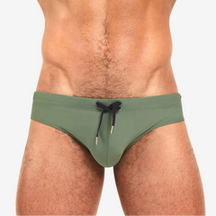 a sexy man in army green Men’s Beach Brat Swim Briefs - pridevoyageshop.com - gay men’s sexy swim briefs, trunks, board shorts, and bikinis