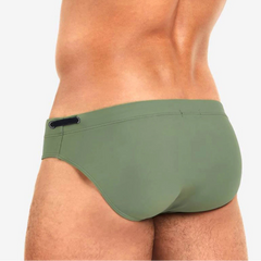 a sexy man in army green Men’s Beach Brat Swim Briefs - pridevoyageshop.com - gay men’s sexy swim briefs, trunks, board shorts, and bikinis