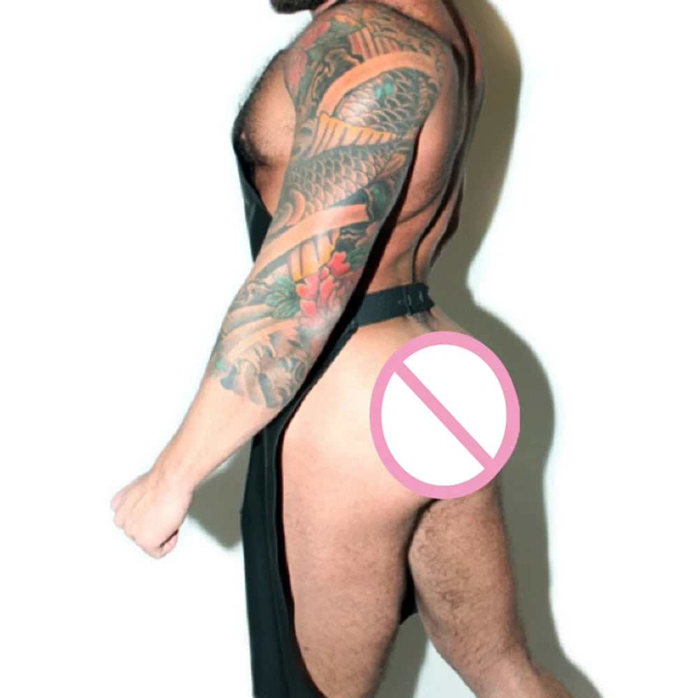 a sexy man in black Daddy’s Brutal Bistro Fetish Apron – pridevoyageshop.com – gay men’s harness, lingerie and fetish wear