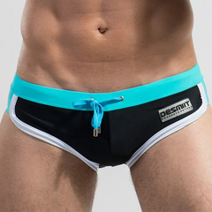 a sexy man in black Desmiit Men’s Colorblock Speed Bulge Swim Briefs - pridevoyageshop.com - gay men’s sexy swim briefs, trunks, board shorts, and bikinis