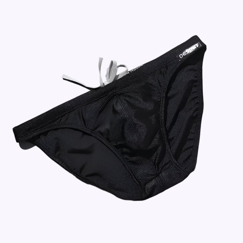 a sexy man in black Desmiit Men’s Heatseeker Micro Swim Briefs - pridevoyageshop.com - gay men’s sexy swim briefs, trunks, board shorts, and bikinis