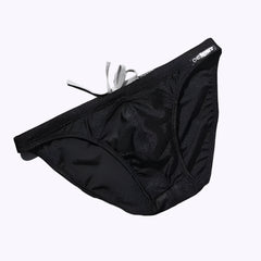 a sexy man in black Desmiit Men’s Heatseeker Micro Swim Briefs - pridevoyageshop.com - gay men’s sexy swim briefs, trunks, board shorts, and bikinis