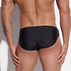 a sexy man in black Desmiit Men’s Sleek Statement Swim Briefs - pridevoyageshop.com - gay men’s sexy swim briefs, trunks, board shorts, and bikinis