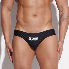 a sexy man in black Desmiit Men’s Sleek Statement Swim Briefs - pridevoyageshop.com - gay men’s sexy swim briefs, trunks, board shorts, and bikinis