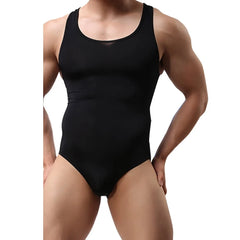 a sexy man in black HotBod Classic Tank Bodysuit showing defined torso, tank-cut straps and snug bulge fit – pridevoyageshop.com – gay men’s harness, lingerie and fetish wear