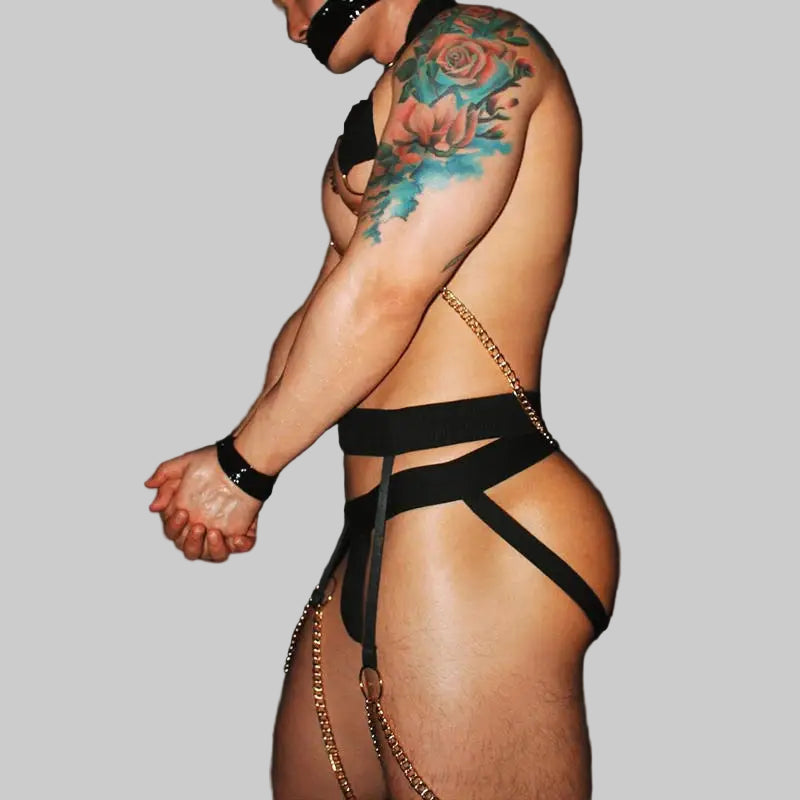 a sexy man in black Men’s After Dark Gold-Chain Harness & Garter Set – pridevoyageshop.com – gay men’s harness, lingerie and fetish wear
