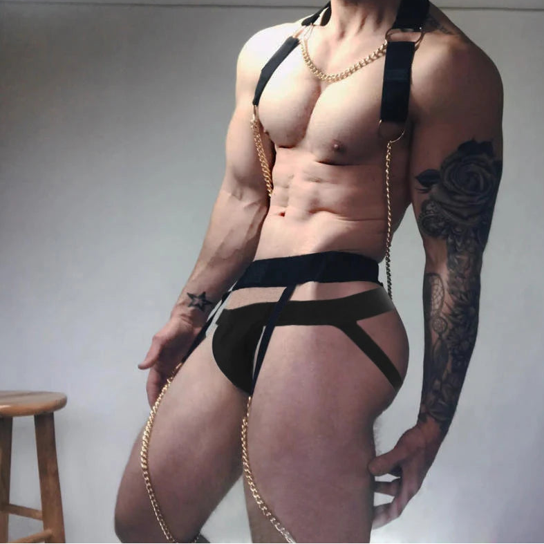 a sexy man in black Men’s After Dark Gold-Chain Harness & Garter Set – pridevoyageshop.com – gay men’s harness, lingerie and fetish wear
