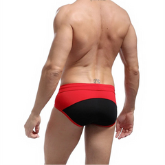 a sexy man in black Men’s Brave Package Swim Briefs - pridevoyageshop.com - gay men’s sexy swim briefs, trunks, board shorts, and bikinis