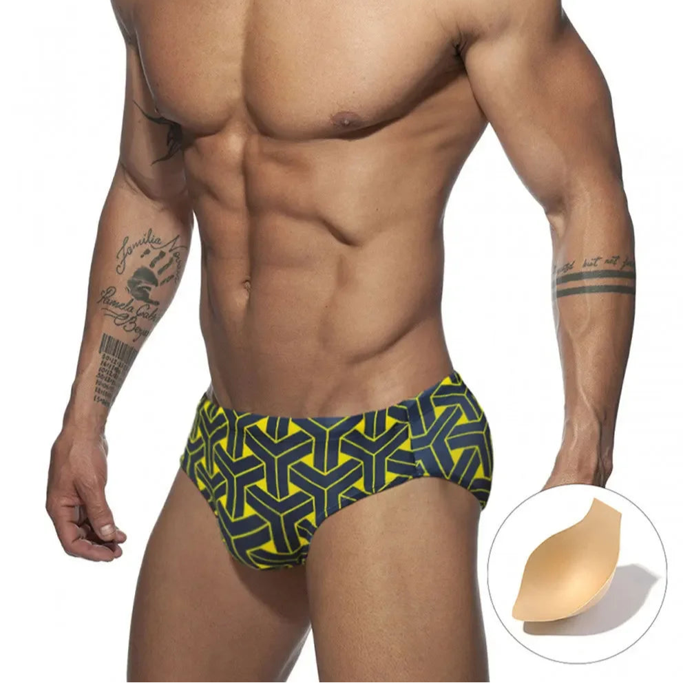 a sexy man in black Men’s Brickhouse Booty Swim Briefs with pad - pridevoyageshop.com - gay men’s sexy swim briefs, trunks, board shorts, and bikinis