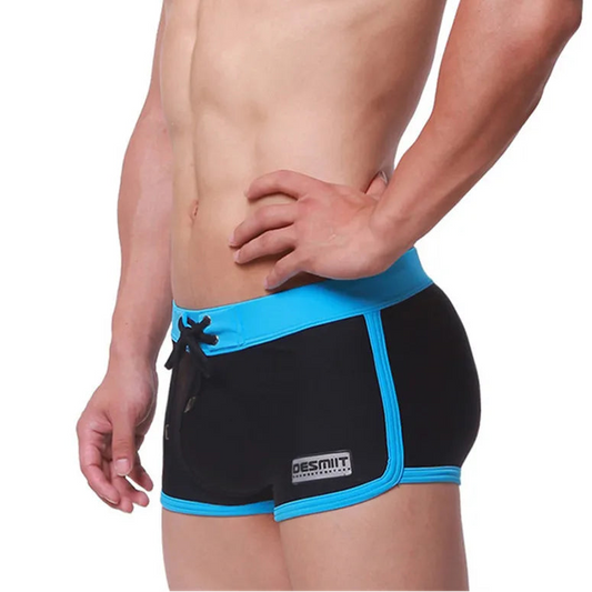 a sexy man in black Men’s Circuit Beat Low Rise Swim Trunks - pridevoyageshop.com - gay men’s sexy swim briefs, trunks, board shorts, and bikinis