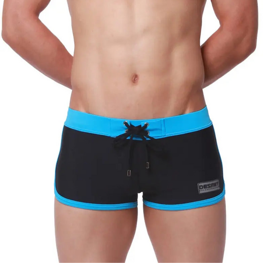 a sexy man in black Men’s Circuit Beat Low Rise Swim Trunks - pridevoyageshop.com - gay men’s sexy swim briefs, trunks, board shorts, and bikinis