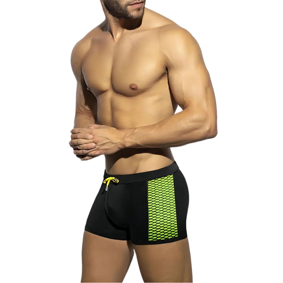 a sexy man in black Men’s Circuit Spark Low Rise Swim Trunks - pridevoyageshop.com - gay men’s sexy swim briefs, trunks, board shorts, and bikinis
