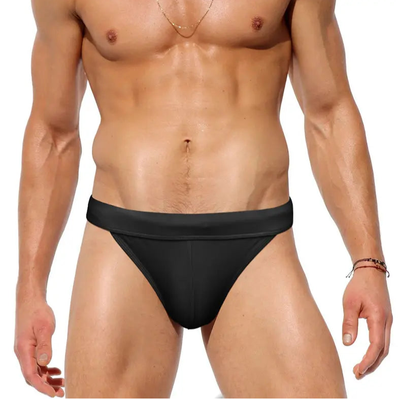 a sexy man in black Men’s Clean Slate Swim Briefs - pridevoyageshop.com - gay men’s sexy swim briefs, trunks, board shorts, and bikinis