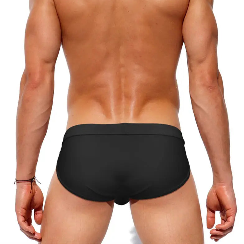 a sexy man in black Men’s Clean Slate Swim Briefs - pridevoyageshop.com - gay men’s sexy swim briefs, trunks, board shorts, and bikinis