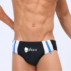 a sexy man in black Men’s Double Zipper Pouch Swim Briefs - pridevoyageshop.com - gay men’s sexy swim briefs, trunks, board shorts, and bikinis