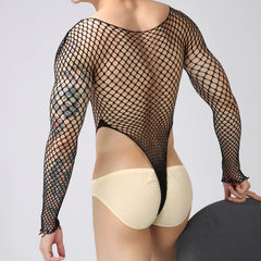 a sexy man in black Men’s Ensnare Fishnet Thong Bodysuit – pridevoyageshop.com – gay men’s harness, lingerie and fetish wear